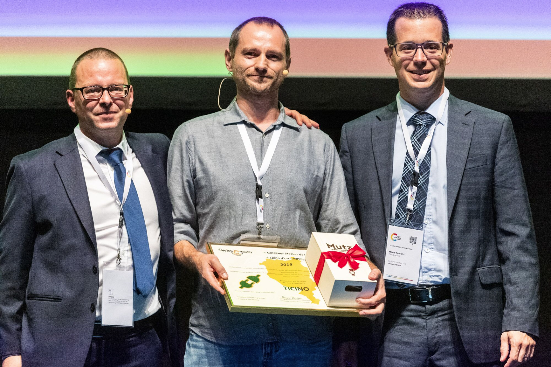 Krispin Romang (Geschäftsführer Swiss eMobility), Michele Fasciana (Fachstelle für Luft, Klima und erneuerbare Energie Kanton Tessin) und Marco Romano (Nationalrat CVP und Vorstand Swiss eMobility)